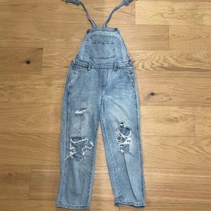 Ripped jean overalls